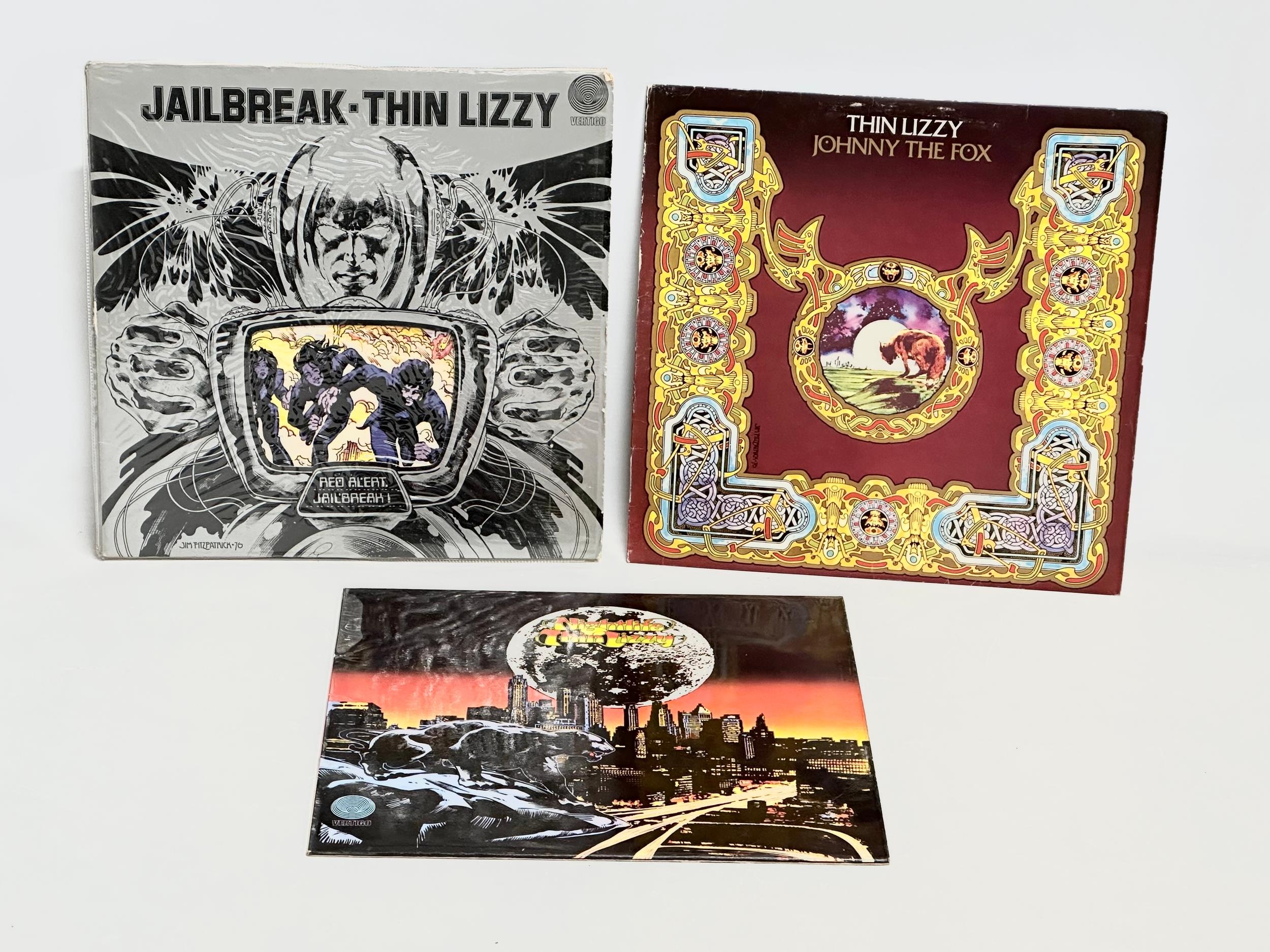 3 Thin Lizzy records. Thin Lizzy Johnny the Fox. Thin Lizzy Jailbreak. Thin Lizzy Nightlife.