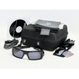 An Oakley Thump 512MB earphone sunglasses with case and accessories.