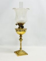 A good quality late Victorian brass oil lamp by Evered & Co LTD, London. With later shade. 65cm