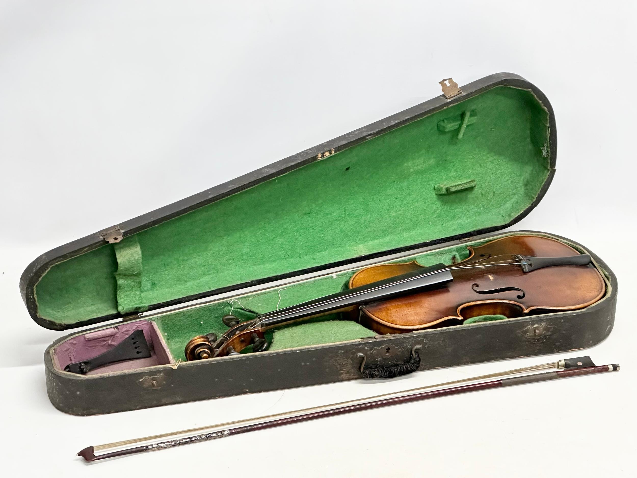 A late 19th/early 20th century violin with case.