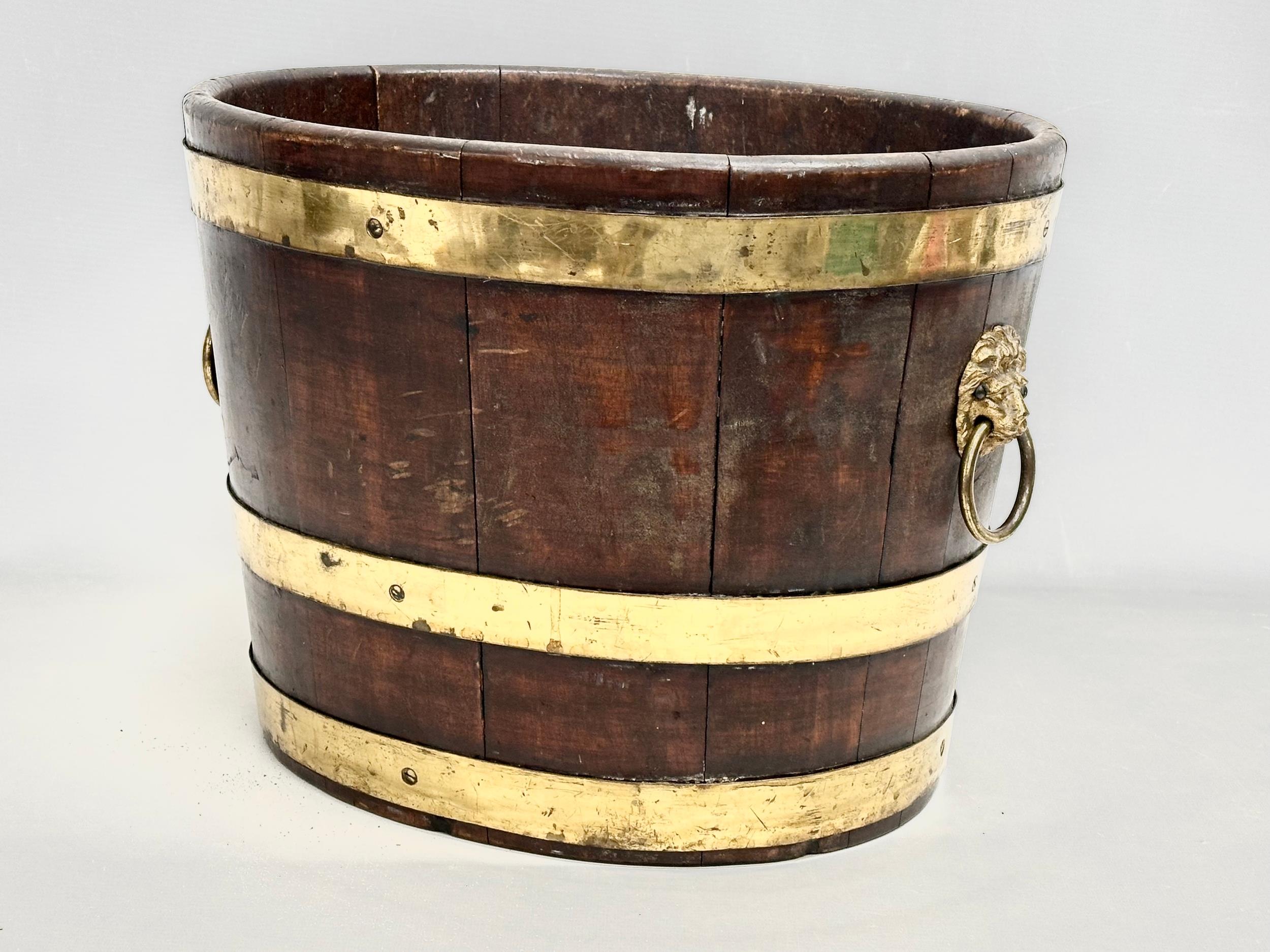 A George III brass bound wine cooler with lion ring handles and original liner. Circa 1780-1790. - Image 2 of 3