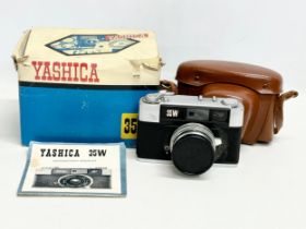 A Yashica 35W camera with case and original box.