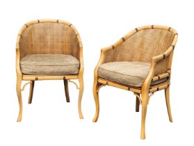 A pair of good quality French faux bamboo tub armchairs with berger back and seats by Grange.