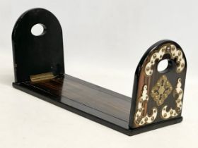 A Victorian coromandel wood book stand with brass mounts. 35cm