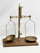 A late 19th century W & T. Avery LTD brass shops scales. 51x28x60cm