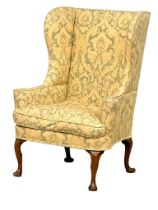 A George I, early 18th century, walnut wingback armchair on Queen Anne legs. Circa 1720. 85x77x120cm