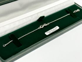 A silver bracelet with box. 2.87 grams. 19cm open.