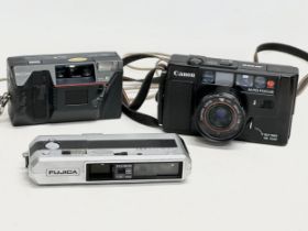 3 vintage cameras. A Canon AF35M. A Ricoh AF-50. Pocket Fujica 600.