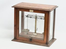 A 1940’s lab balance scales in case. W.& J. George LTD, Late F.E. Becker & Co. 44x26x39cm