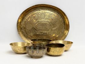 19th century Middle Eastern brass bowls and tray. Tray measures 29.5x24.5cm. Bowls 12cm, 11.5cm,