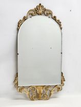 A vintage ornate gilt framed bevelled mirror. 45x84cm