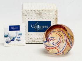 A Caithness Golden Jubilee Celebtration Art Glass paperweight with box. Paperweight measures 8.5x8.