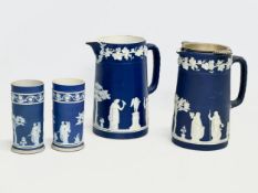 4 pieces of late 19th century Wedgwood Jasper Ware. A pair of jugs 17x19.5cm. A pair of cylinder