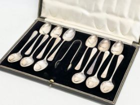 A set of Cooper Brothers & Sons silver spoons and tongs in case. 154 grams.