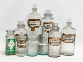 A collection of late Victorian/Edwardian chemist bottles. Pair of largest 26cm. 3 measuring 23cm