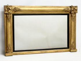 A late 19th century William IV style gilt framed over-mantle mirror. Carver & Gilder. Circa 1880.