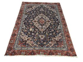 A very large vintage Middle Eastern hand knotted rug. 316x223cm