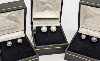 3 pairs of pearl earrings.