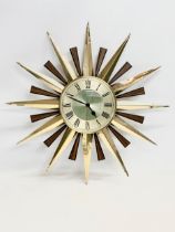 A Mid Century sunburst wall clock by Metamec. 59cm