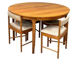 A McIntosh Mid Century teak tuck away table and 4 chairs. Open 168x122x74cm. Closed 122x74cm