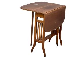 An Edwardian mahogany Sutherland table. Open 87x61.5x65cm. Closed 20x61.5x65cm (4)