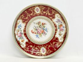 A large Atelier Camille Le Tallec porcelain charger bowl. Hand painted classical style gilding