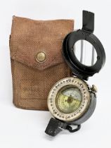 A British WWII compass with case. Stamped 1944.