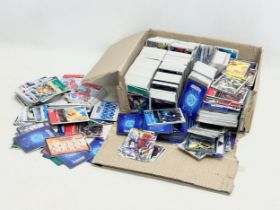 A large collection of DIGIMON cards.