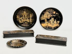 A collection of late 19th century Japanese gilt painted lacquerware. A pair of long lidded boxes