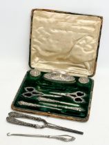 A sterling silver handled part manicure set with case by E.S.B, Birmingham. With a silver handled