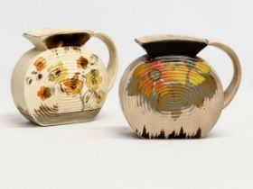 A pair of 1930’s Art Deco pottery jugs by Sylvac. 19x7x16cm