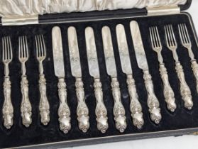 A large cased early 20th century silver plated cutlery set.