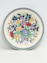 A large 1930’s Poole Pottery charger designed by Gwen Haskins. 35cm