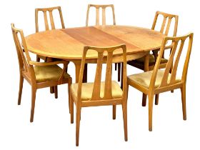 A Mid Century teak extending dining table and 6 chairs by Nathan Furniture. 1970’s. Open