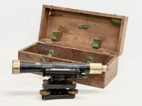 An early 20th century Hallbro theodolite in case. Theodolite measures 35cm. Case measures 9x17x15cm