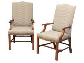 A pair of good quality solid teak Gainsborough style armchairs.