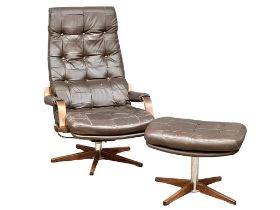A Swedish Mid Century leather and faux rosewood armchair with matching stool.