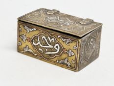 A 19th century Cairo Ware silver and copper inlaid brass trinket box. 9.5x6x4.5cm