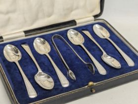 A set of 6 silver spoons and silver tongs in case, 1926, by Charles William Fletcher. Spoons measure