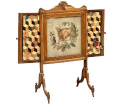 A large William IV mahogany firescreen with tapestry and needlework panel. Circa 1830. Open