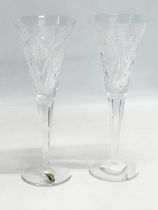A pair of Waterford Crystal Millennium Collection ‘Happiness Toasting’ champagne flutes. 23.5cm