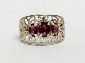 A ladies ornate silver ring. Size P.