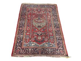 A vintage Middle Easter hand knotted rug, 206cm x 138cm