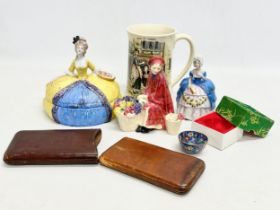 A collection of early 20th century porcelain a leather cigar case. Two 1930’s half doll powder