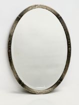 An early 20th century Arts & Crafts bevelled mirror. 50x70cm