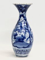 A late 19th century Japanese emperor Kyoto blue and white baluster vase with frilled rim. Meiji