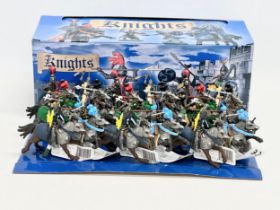 A box of Britains model mounted knights.
