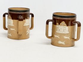 A pair of large early 20th century Royal Doulton Lambeth stoneware Tyg tankard mugs. Silver (plated)
