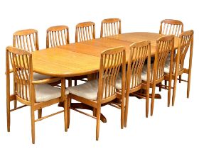 A Benny Linden Mid Century teak 2 leaf extending dining table and 10 chairs. 1970’s. Full extended