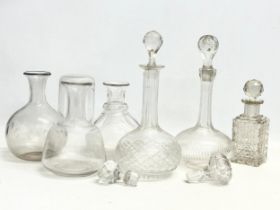 A quantity of early 20th century decanters. Tallest 27cm.